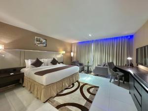 Postel nebo postele na pokoji v ubytování Boulevard Owerri Hotel