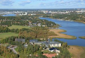 an aerial view of a town and a lake at Meri-Karina in Turku
