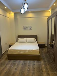 Postel nebo postele na pokoji v ubytování Duplex District 9 دوبلكس الحي التاسع في ارقي حي بالشيخ زايد
