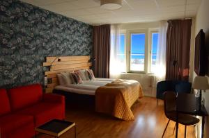 Postel nebo postele na pokoji v ubytování Hotel Falun