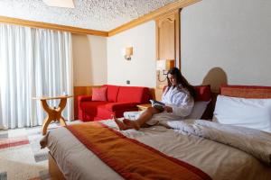 Postel nebo postele na pokoji v ubytování Hotel Intermonti