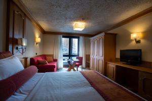 Postel nebo postele na pokoji v ubytování Hotel Intermonti