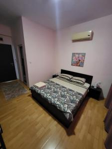 a bedroom with a bed in a room at Стаи за гости Пауза in Stara Zagora +27 photos
