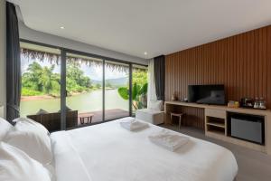 Postel nebo postele na pokoji v ubytování Cherlynn Resort + 37 fotografií