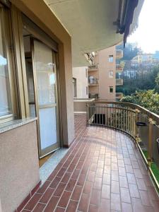 a balcony of a building with a view of a city at The Charme - Modern Apartment in Como with Balcony in Como