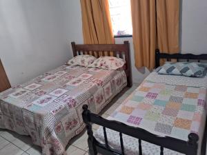 Postel nebo postele na pokoji v ubytování Aconchego da vovó