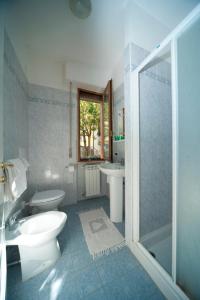 a bathroom with a toilet and a sink and a shower at Hotel La Toscana in Arezzo
