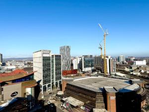 an aerial view of a city with a building at Cardiff Skyline Penthouse Apartment Free Parking Sleeps 8 in Cardiff