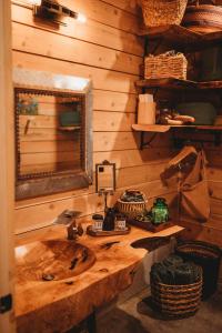 a wooden bathroom with a sink and a mirror at The Eagle's Roost in Port Angeles +47 photos
