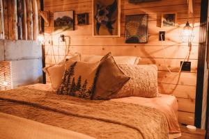 a bedroom with a bed with pillows on it at The Eagle's Roost in Port Angeles