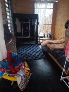 a bedroom with two bunk beds and a window at Bugambilia house in La Tinguiña