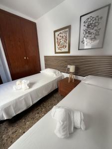 En eller flere senge i et værelse på Zen mar Confort & Relax centro Calafell