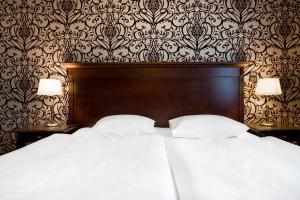 Posteľ alebo postele v izbe v ubytovaní Hotel Wileński