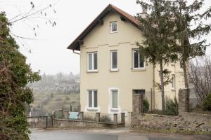 a white house with a fence in front of it at BALANCE apartments - CAPPUCCINO in Znojmo