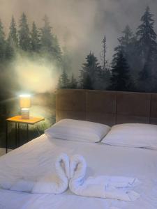 Postel nebo postele na pokoji v ubytování Domek za rzeką 2