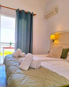 A bed or beds in a room at Ever Green beach Apartments
