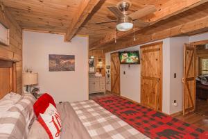 a bedroom with a bed and a ceiling fan at Sunset Ridge in Sevierville +13 photos