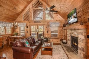 a living room with a couch and a fireplace at Sunset Ridge in Sevierville
