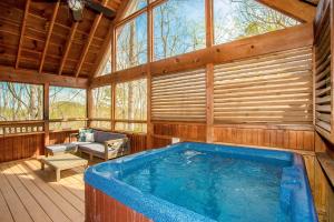 a large jacuzzi tub in a wooden house at Sunset Ridge in Sevierville