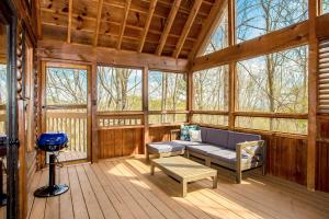 a living room with a couch and a table in a cabin at Sunset Ridge in Sevierville