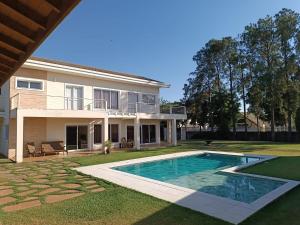 Πισίνα στο ή κοντά στο Casa moderna com lazer e conforto