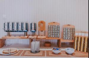 a kitchen with a counter with bowls and aasteryasteryasteryasteryasteryasteryastery at Bellevue Rooms in Stara Baška