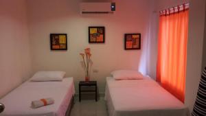 Voodi või voodid majutusasutuse Manzanillo Beach toas