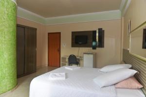 Säng eller sängar i ett rum på Hotel Mais