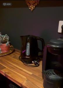 a blender sitting on a counter next to a toaster at La cachette enchantée in Saint-Cyr-la-Campagne