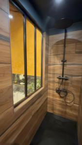 a room with a window and a chair in it at La cachette enchantée in Saint-Cyr-la-Campagne