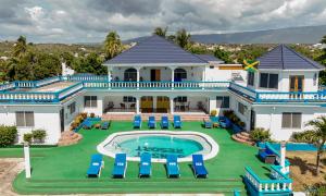 an aerial view of a house with a swimming pool at Beyond Sunset Resort & Villas in Treasure Beach