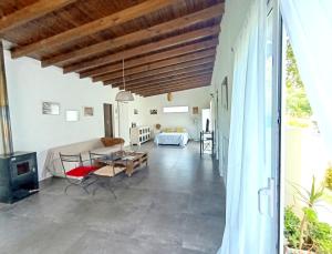 a living room with a couch and a table at Loft en Los Acantilados in Mar del Plata
