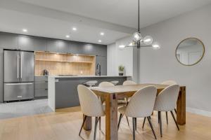 a kitchen and dining room with a table and chairs at Initial - Mountain 302 - Ski-in-out MSA in Beaupré