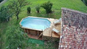 an overhead view of a swimming pool on a hill at La Maison Pop-70's-Spot Nature-B&B in Sarrant