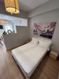 Postel nebo postele na pokoji v ubytování Ikigai Syros