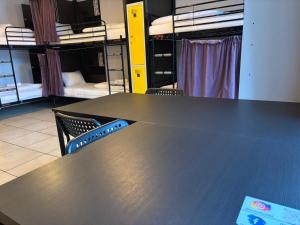 a table and chairs in a room with bunk beds at Dream & HOSTEL - Central Station FaktVat in Kielce