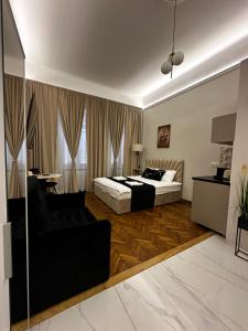 Llit o llits en una habitació de Jacuzzi Berka Apartamenty