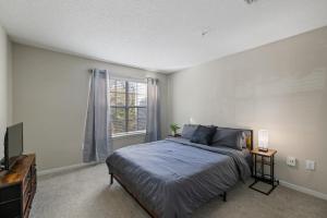 a bedroom with a large bed and a window at Charming3BR Home in Athens Georgia Prime Location in Athens