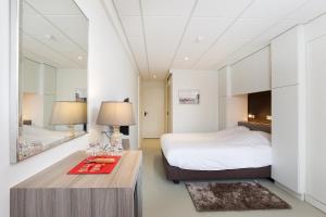 Postel nebo postele na pokoji v ubytování Rewindhotel