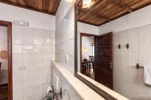 a bathroom with a mirror and a sink at Tango by Huskalia in Breña Alta +17 photos