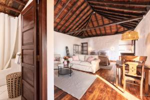 a living room with a couch and a table at Soleil by Huskalia in Breña Alta