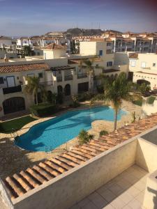 Bazén v ubytování La Casita de la Playa 24-38 nebo v jeho okolí
