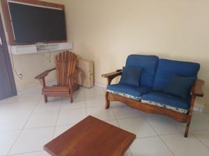 Uma TV ou centro de entretenimento em Casa Centro Piscina