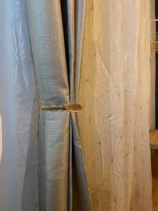 a curtain that is tied up with a gold ribbon at La città di Pulcinella in Naples