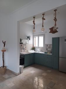 Η κουζίνα ή μικρή κουζίνα στο Asprocyclia House