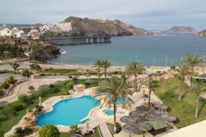 an aerial view of a resort with a pool and the ocean at Ático Dos Bahías in Águilas