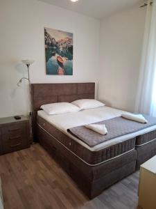 Postel nebo postele na pokoji v ubytování Apartment Taja
