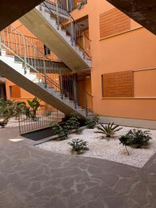 a building with a staircase and plants in front of it at VV Canary Islands 1 in San Miguel de Abona