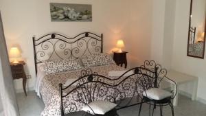 Säng eller sängar i ett rum på Villa Midolo