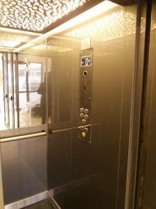 a elevator with a sign on the side of it at Sophia Studio in Iaşi